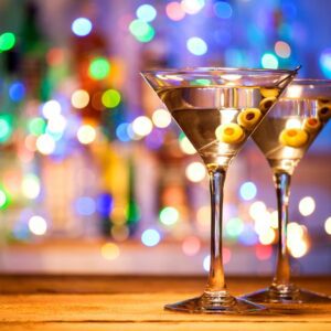 Two Glasses of Martini Cocktail on the wooden table