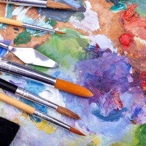 Different Paint Brushes On a Painting Board